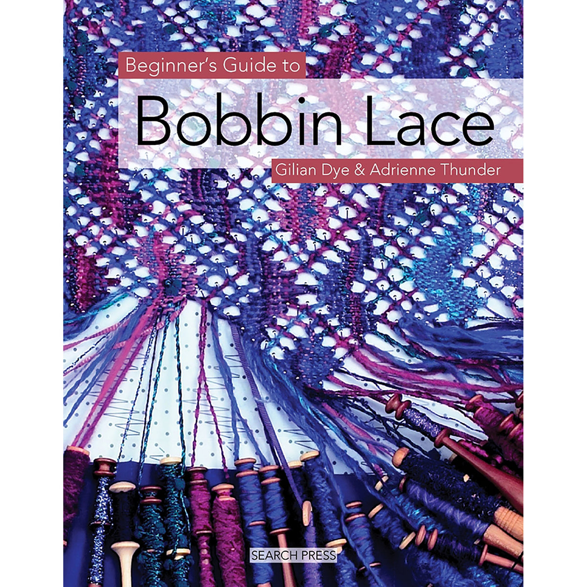 A photo of the cover of Beginner’s Guide to Bobbin lace featuring a multicolored geometric lace project and many bobbins.