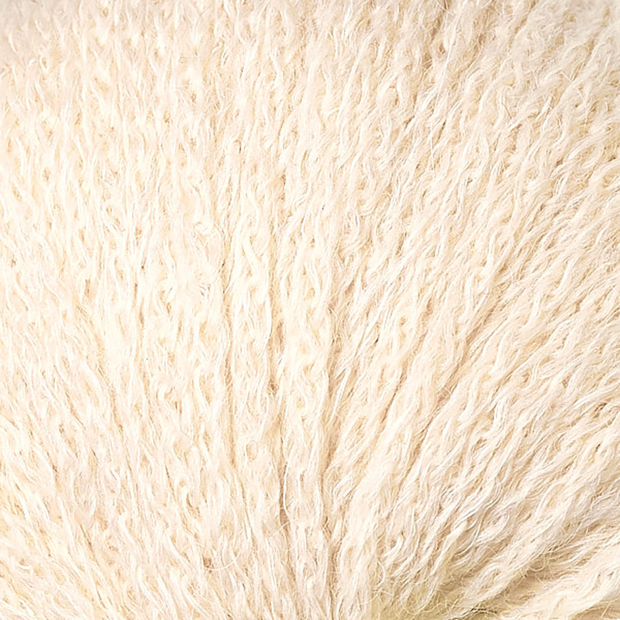 Closeup of Berroco Hearthside Birch, a buttercream color.