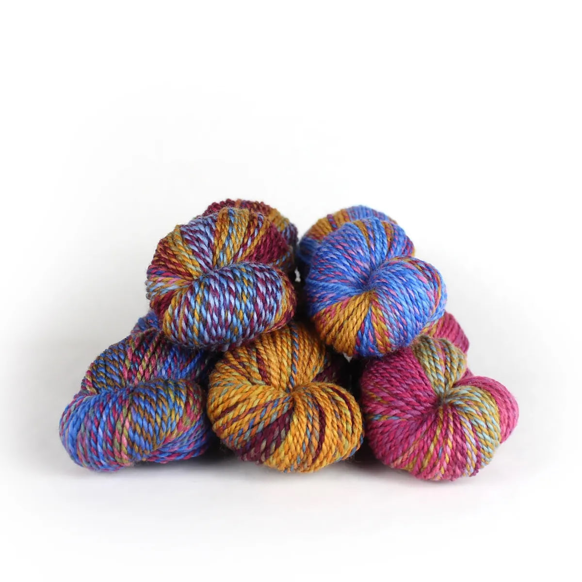 Five skeins of JFM Making Tracks Carnival, variegated with yellow, pink, purple, and orange