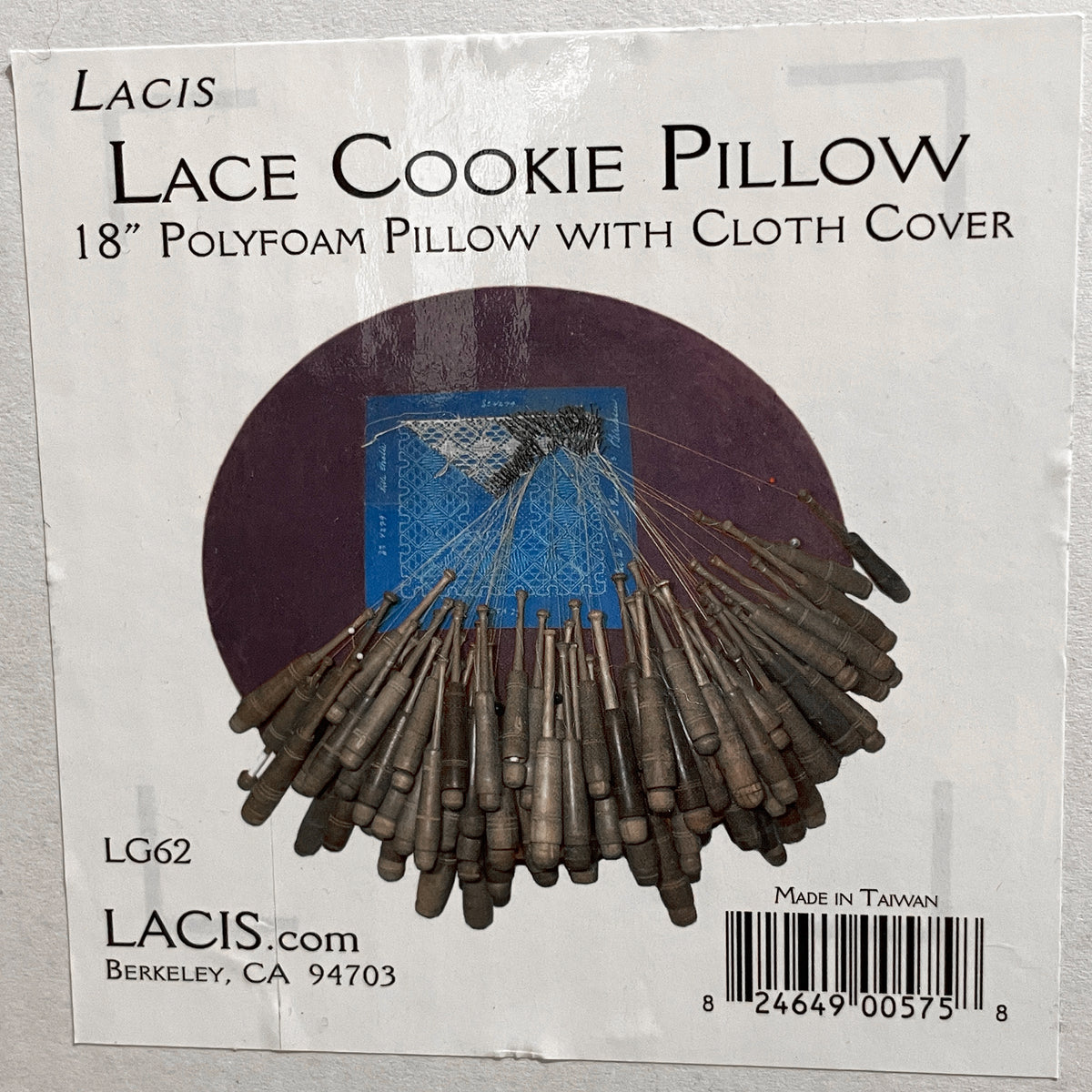 A photo of the Lacis Lace Cookie Pillow box containing an 18” polyfoam pillow with a cloth cover.