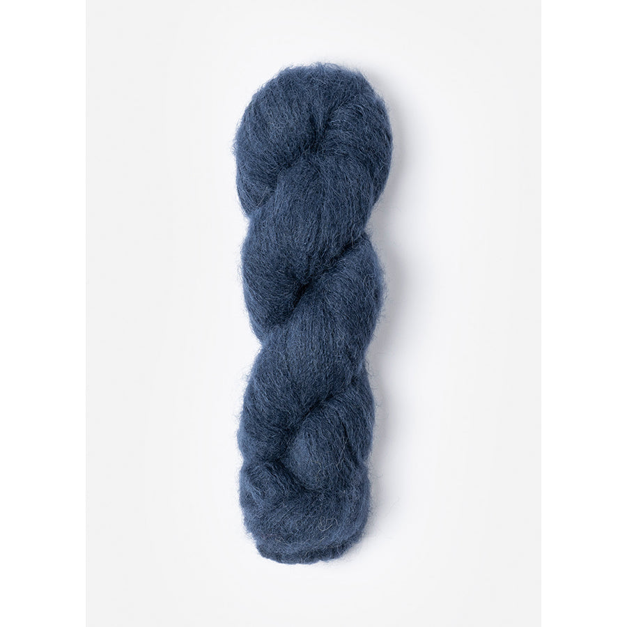 A skein of Blue Sky Fibers Prairie in Dragonfly, a dark blue