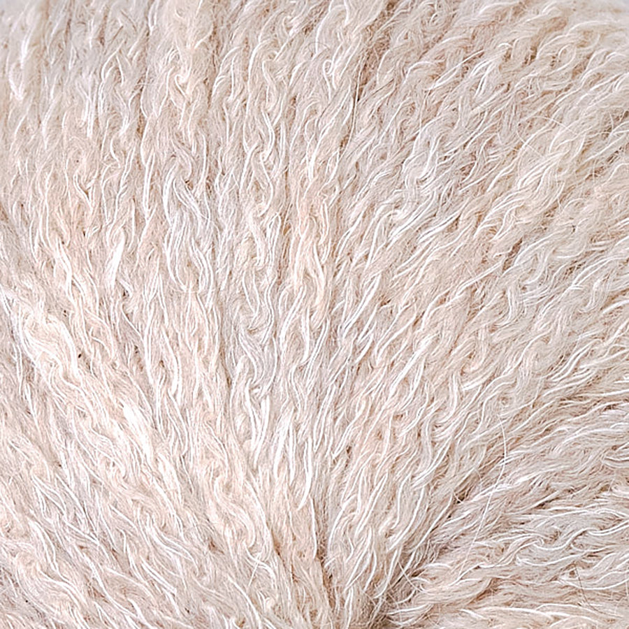 Closeup of Berroco Hearthside Honey Maple, a light sandy brown and cream color.