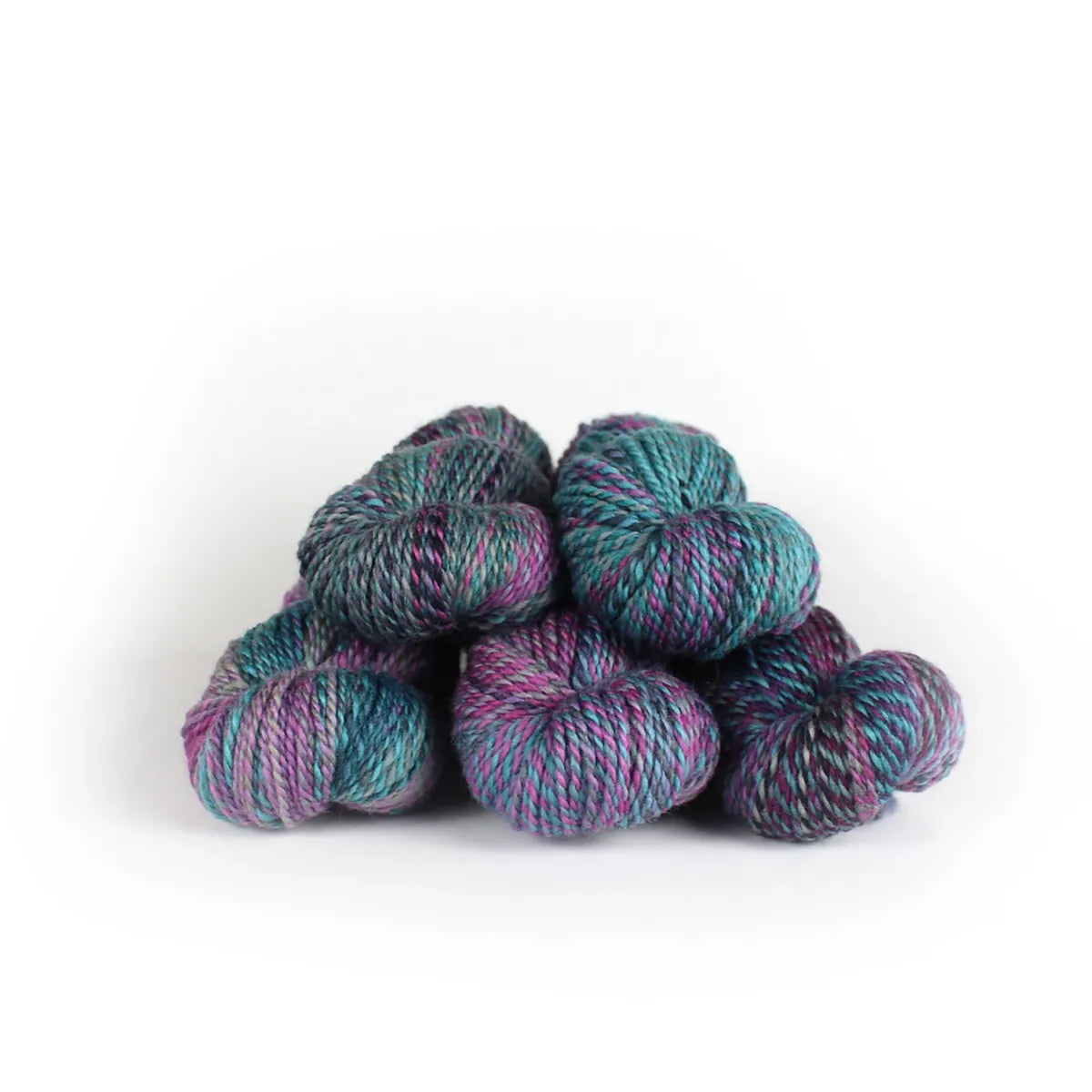 Five skeins of JFM Making Tracks Lookout Lodge, variegated purple, magenta, turquoise, and blue