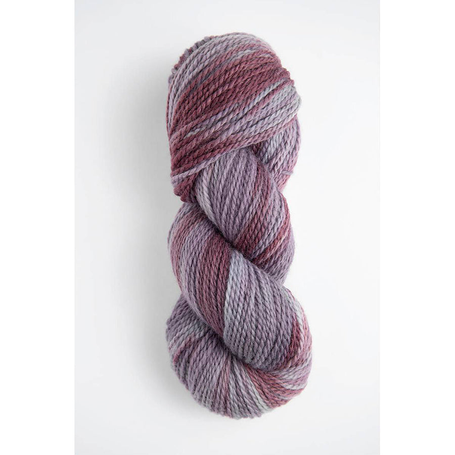 A skein of Amano Riti Northern Lights in variegated shades of orchid and plum purples