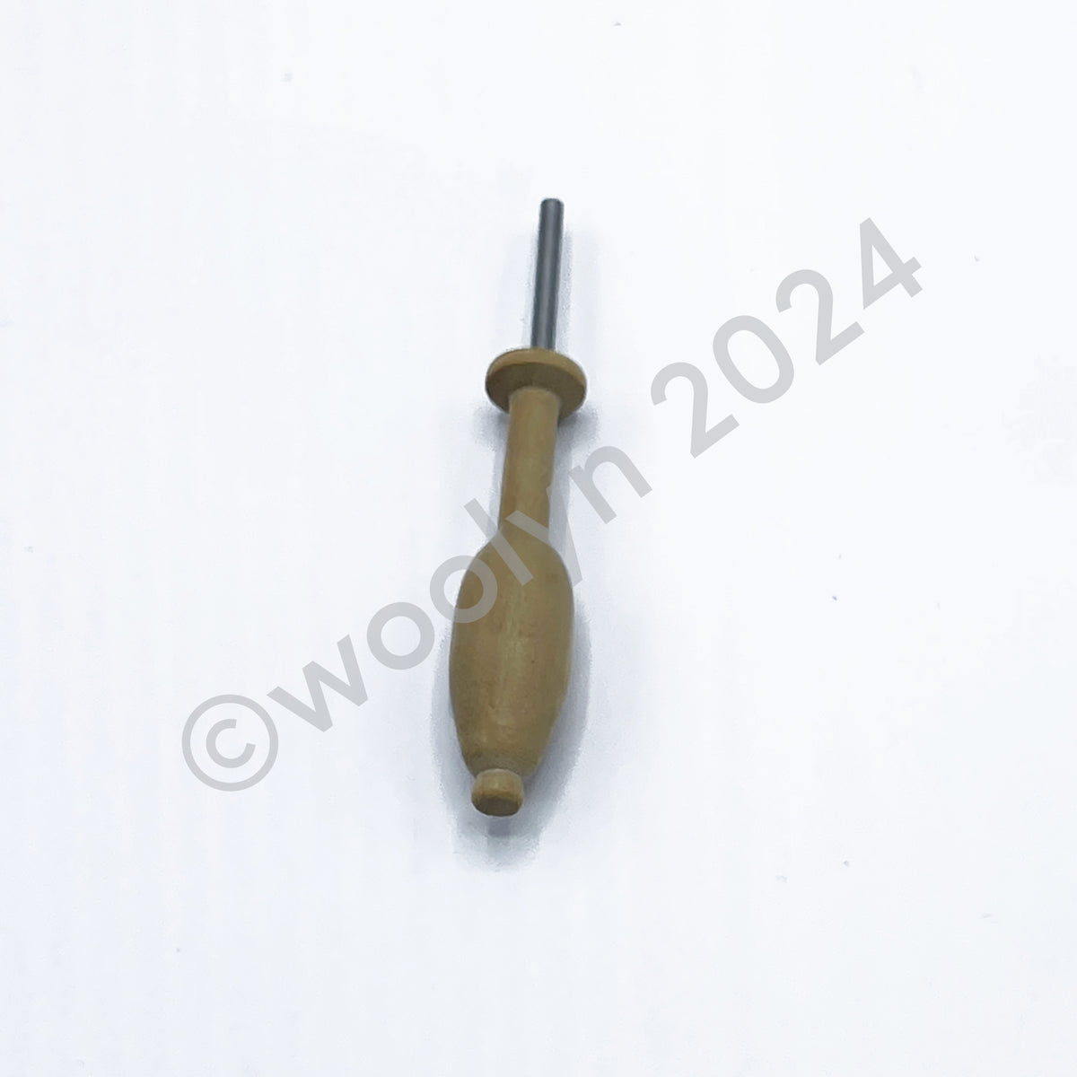 Image of a pin pusher with a flared wooden body and metal tip.