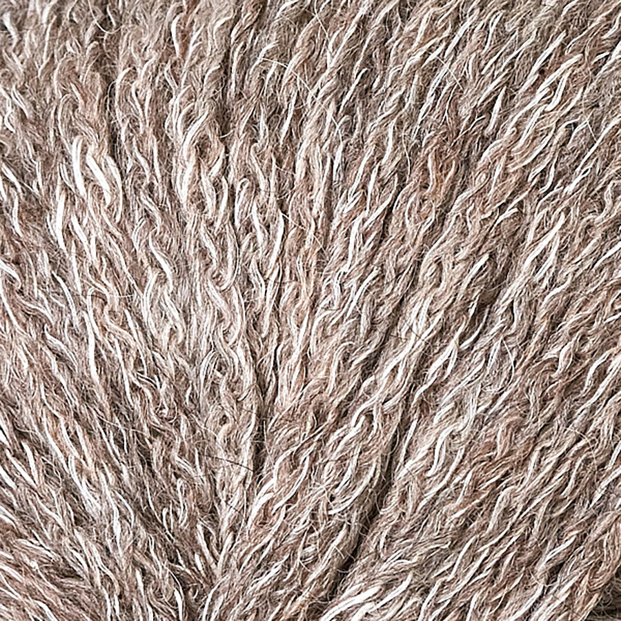 Closeup of Berroco Hearthside Provincial, a sandy brown and cream color.