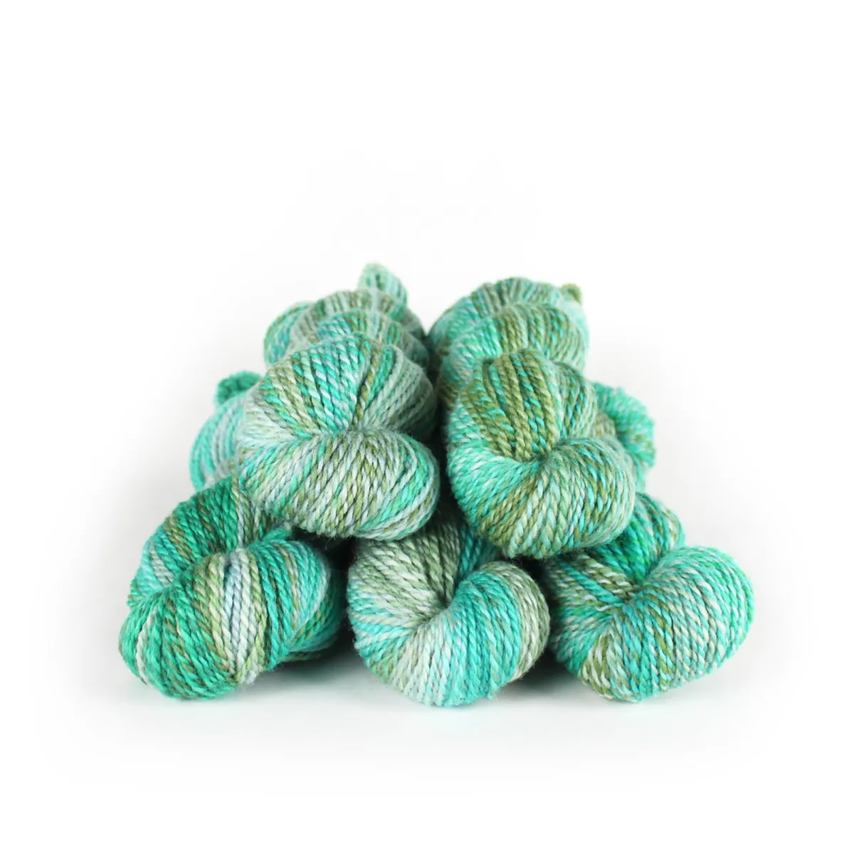 Five skeins of JFM Making Tracks Seaglass, variegated turquoise, teal, and green