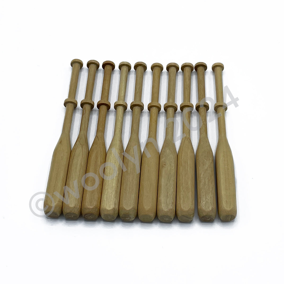 A set of Square bobbins made of wood with wide square handles with rounded edges.