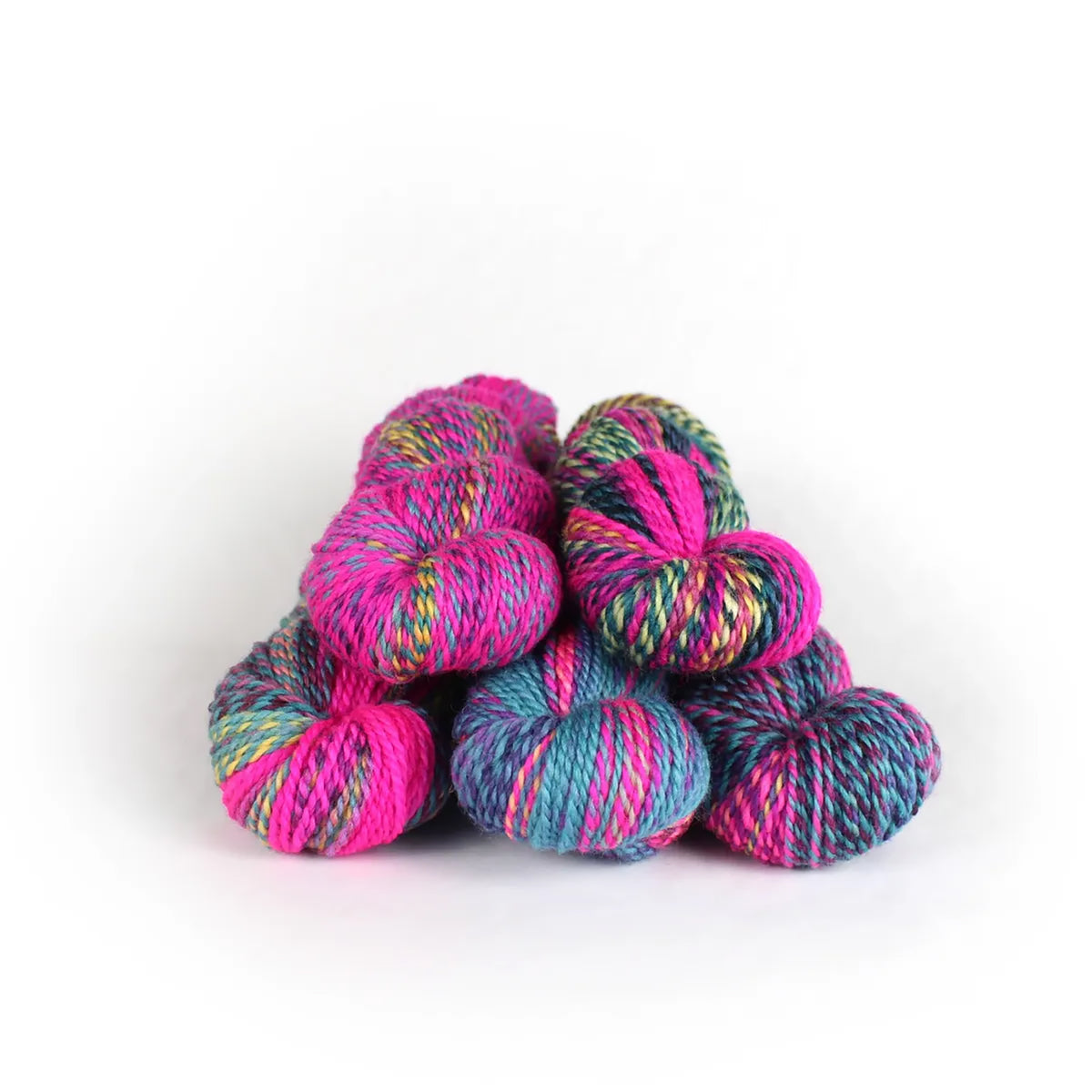 Five skeins of JFM Making Tracks Vermont Vice, variegated electric pink, light blue, with hints of purple, yellow, and green