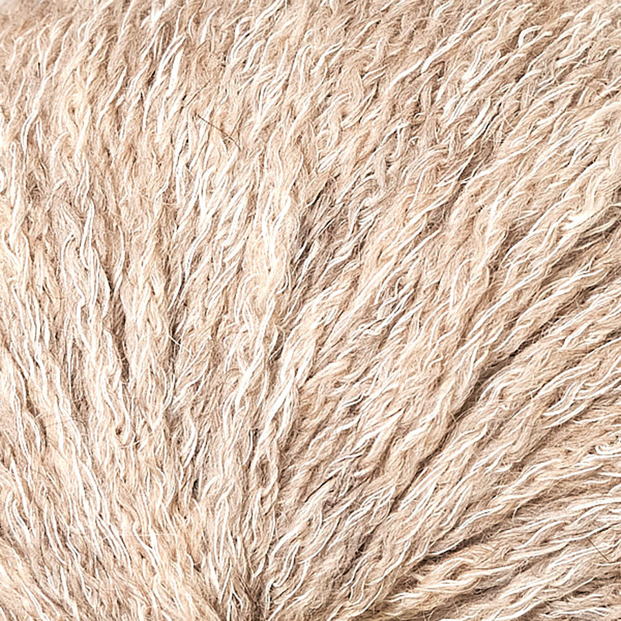 Closeup of Berroco Hearthside Walnut, a light tan brown and cream color.