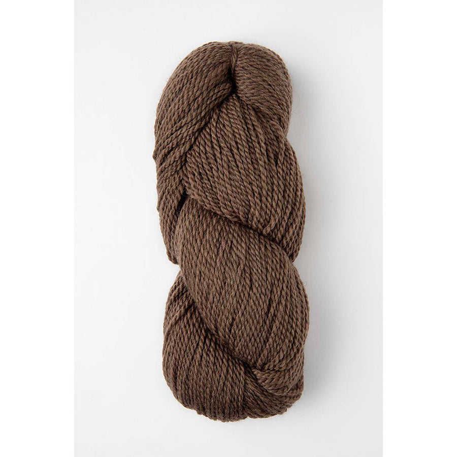 A skein of Amano Riti Wooden Log in a clay brown 