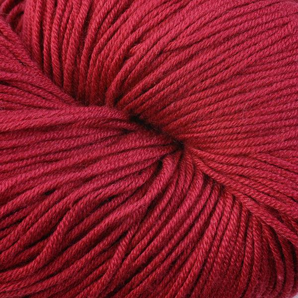 Detail of Berroco Modern Cotton in Naragansett 6651, a bright deep red.