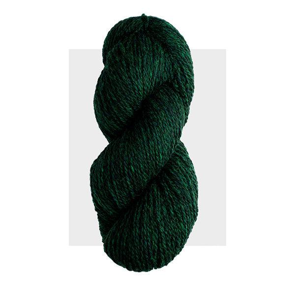 Skein of Harrisville Highland Evergreen, a dark blue green heathered with lighter green.