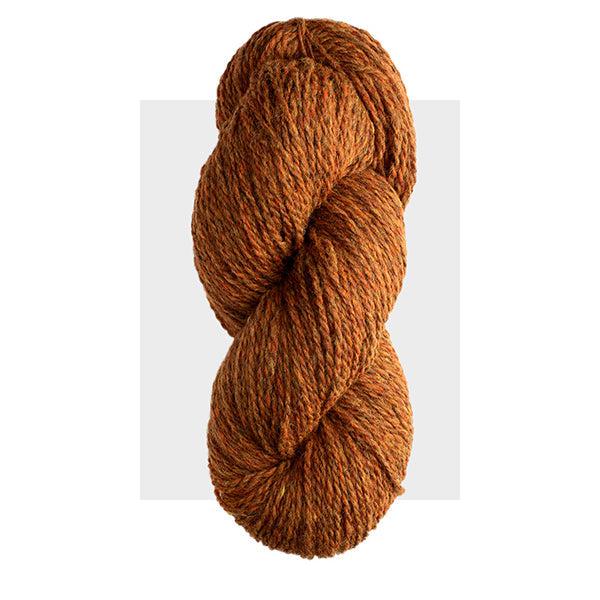 Skein of Harrisville Highland Foliage, a warm orangey brown heathered with brighter orange and dark green.