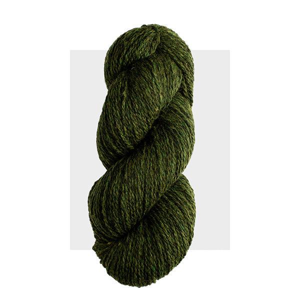 Skein of Harrisville Highland Hemlock, a deep, dark green heathered with lighter green.