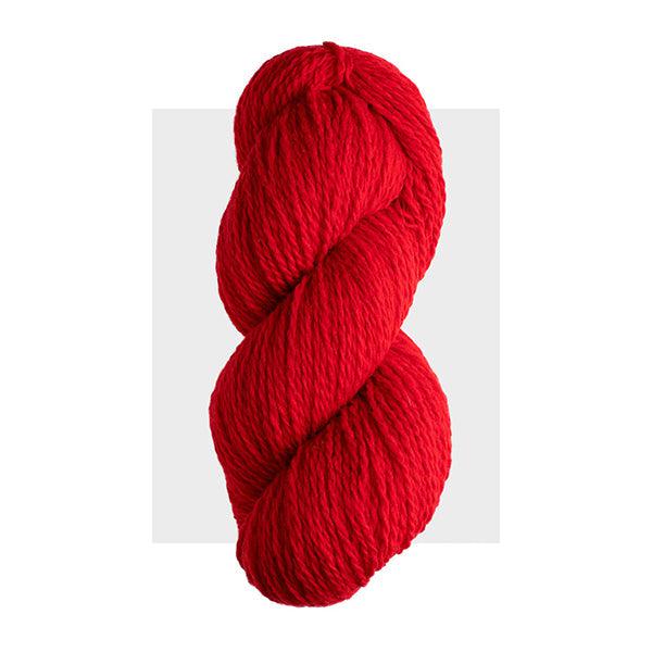 Skein of Harrisville Highland Red, a bright cherry red.