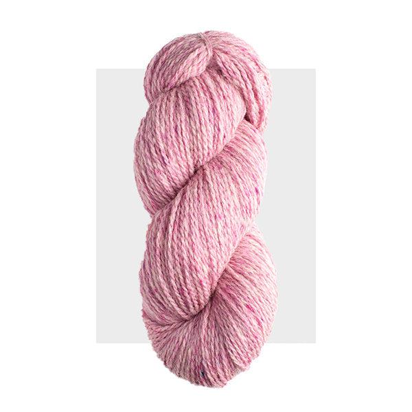 Skein of Harrisville Highland Water Lily, a light carnation pink heathered with darker pink.