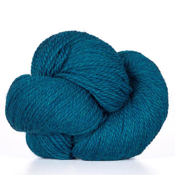 A skein of Kelbourne Woolens Scout Teal Heather 432, a heathered teal blue.