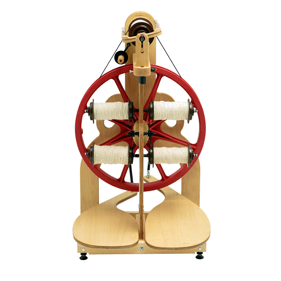 Image of a Schacht Ladybug Lazy Kate with four bobbins that attaches to the Schacht Ladybug for easy plying.