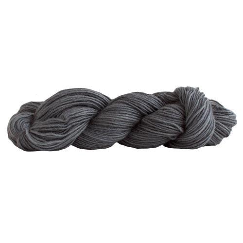 A skein of Manos Silk Blend Kohl 3059, a dark grey.