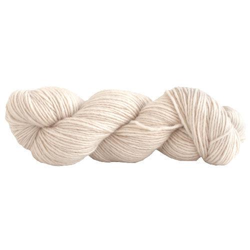 A skein of Manos Silk Blend Natural 3014, an un-dyed off white.