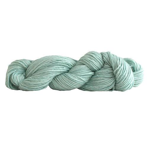 A skein of Manos Silk Blend Oxygen 3214, a pale blue green.