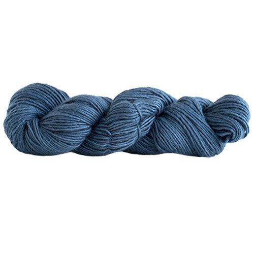 A skein of Manos Silk Blend Pewter 3064, a grey blue.