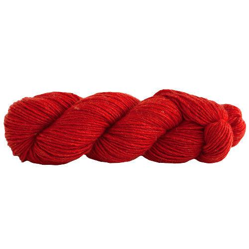 A skein of Manos Silk Blend Tomato 3203, a bright red.