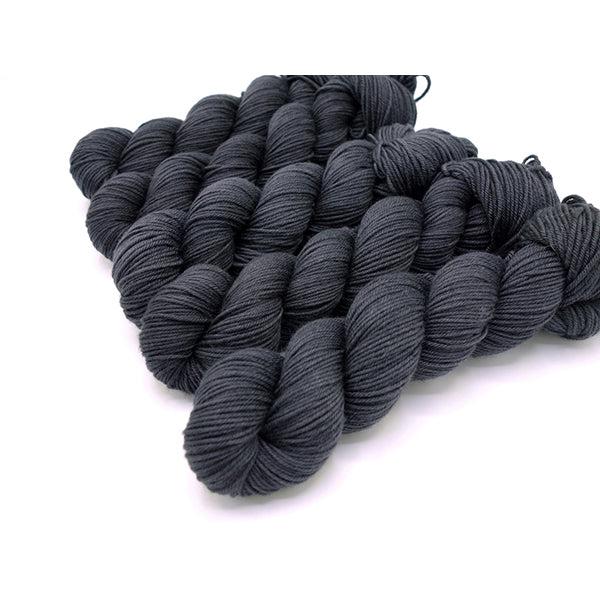 Skeins of Murky Depths Neptune DK Char, a deep, dark grey.